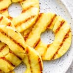 A plate of grilled pineapple.