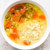 Bowl of lemon chicken orzo soup.