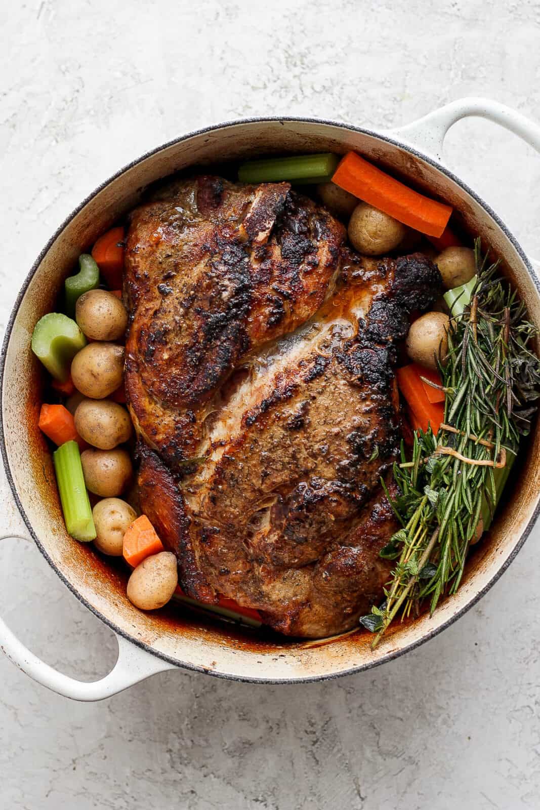 Cooked pork roast in a dutch oven.
