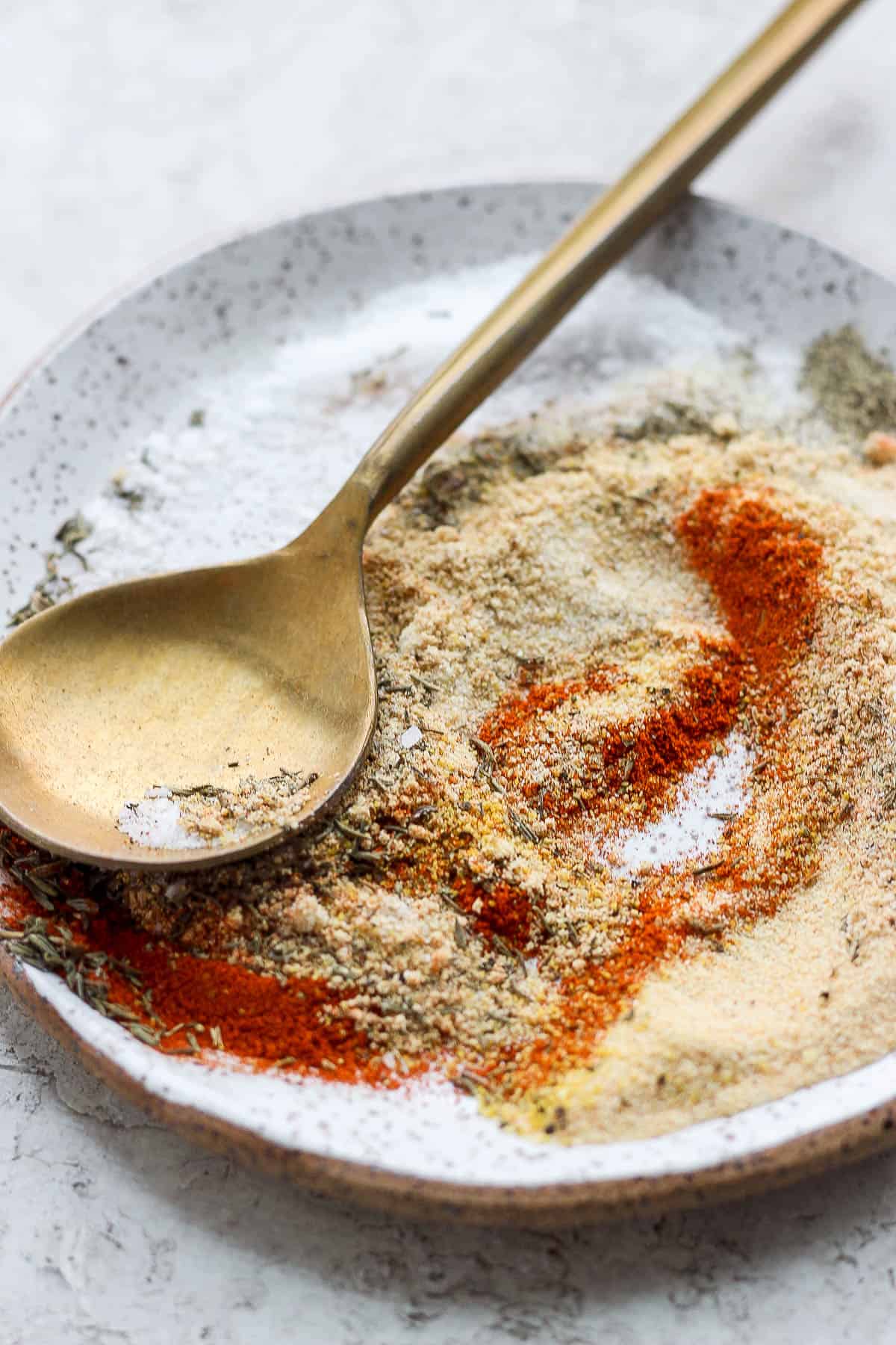 Pork roast seasoning ingredients mixed together on a plate.
