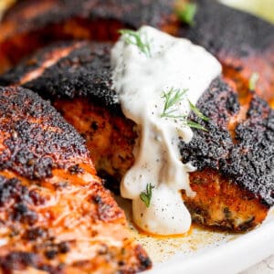 Salmon with salmon dill sauce on top.