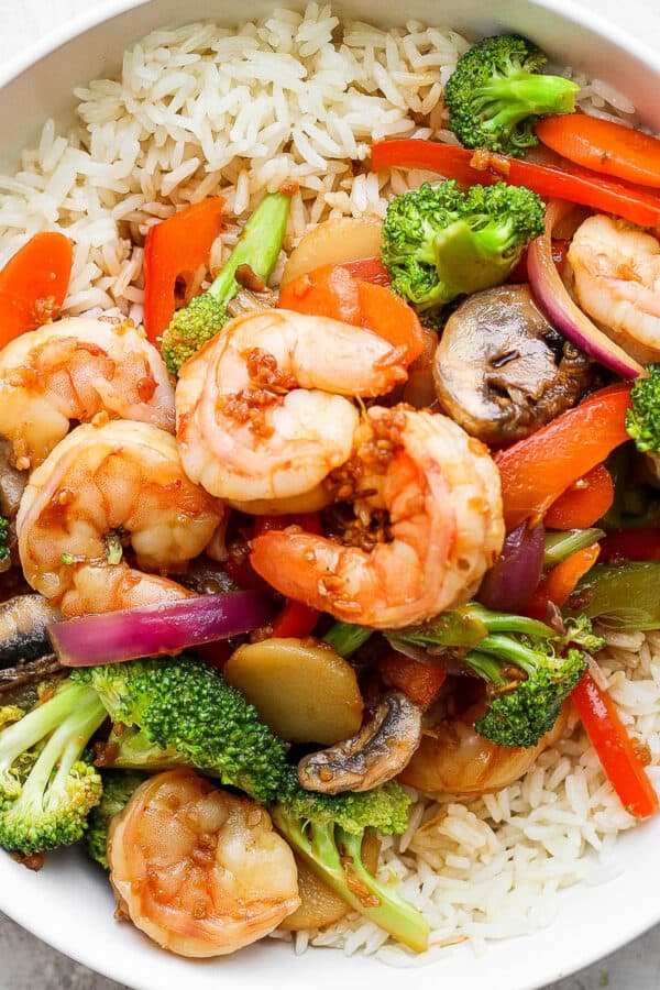 Bowl of shrimp stir fry over rice.