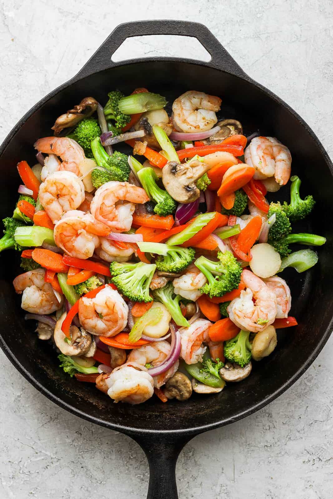 Shrimp stir fry in a cast iron skillet before adding the sauce.