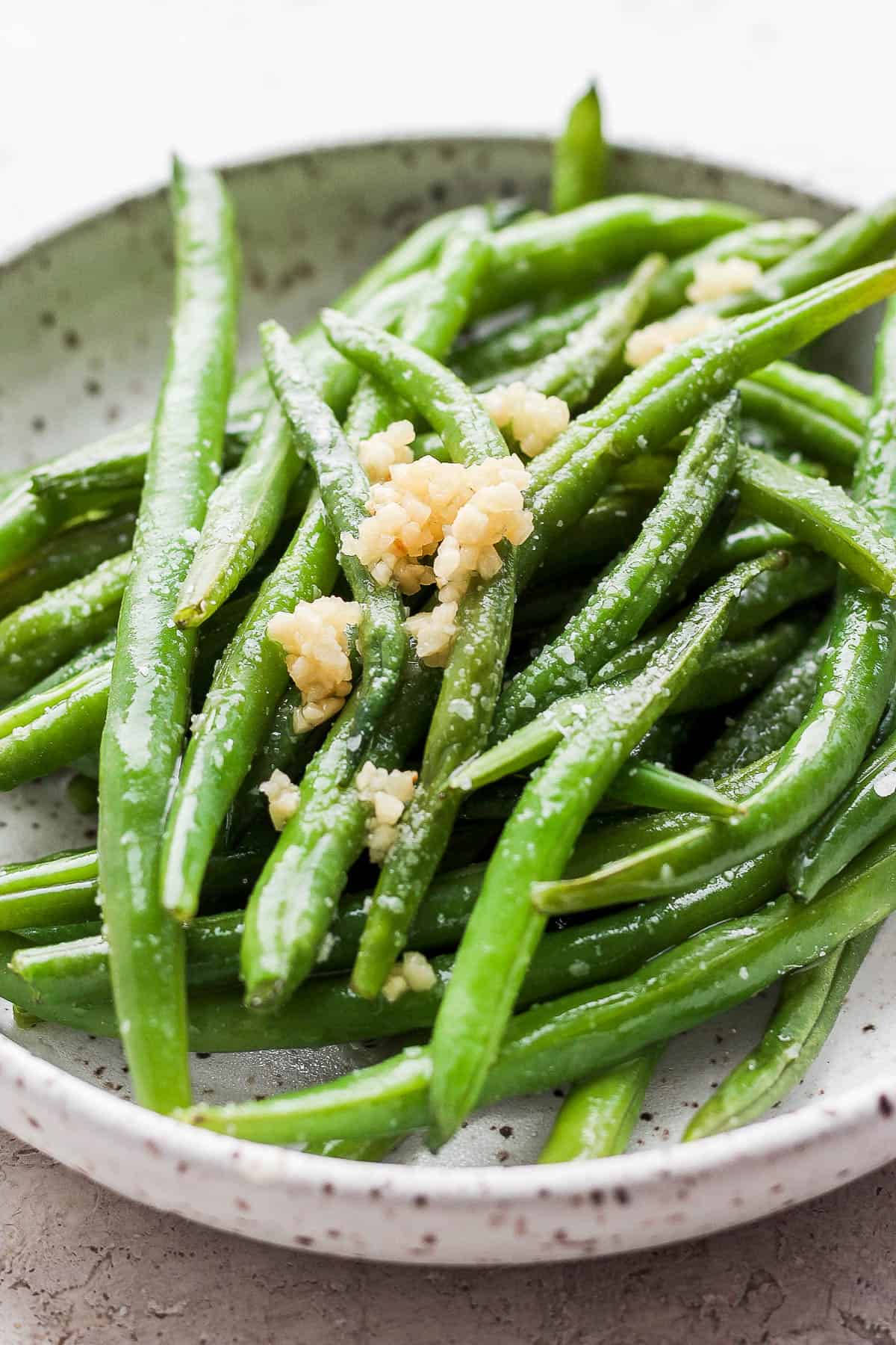 A plate full of smoked green beans.