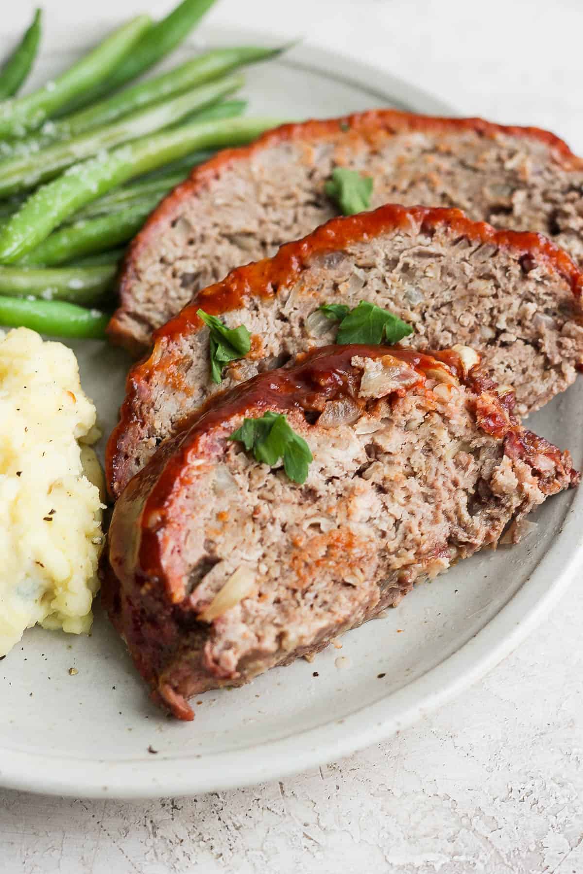 Sliced meatloaf on a plate. 