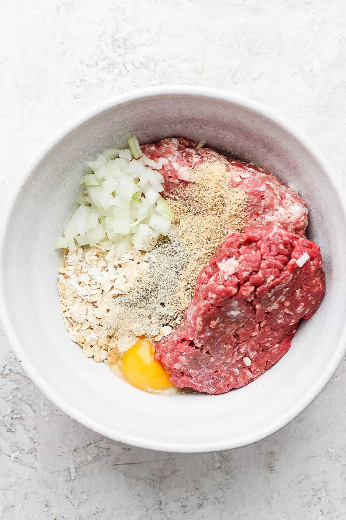 Meatloaf ingredients in a mixing bowl.