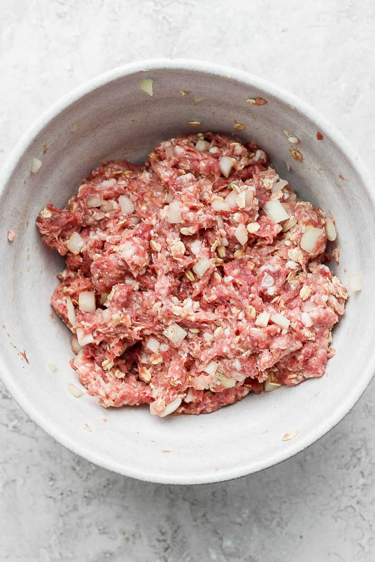 Ingredients all mixed together in a mixing bowl.