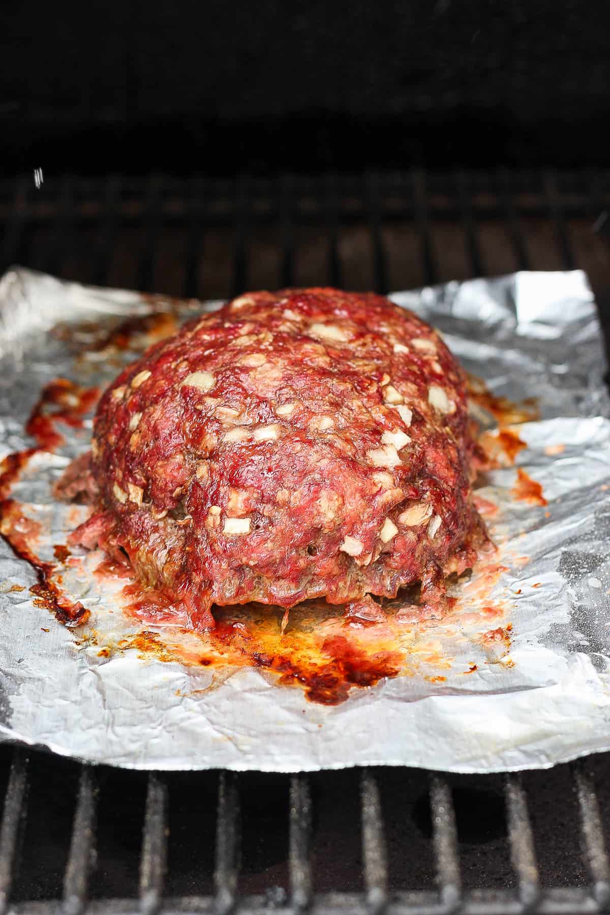 Smoked meatloaf before adding the glaze on the smoker. 