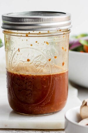 Mason jar with stir fry sauce inside.
