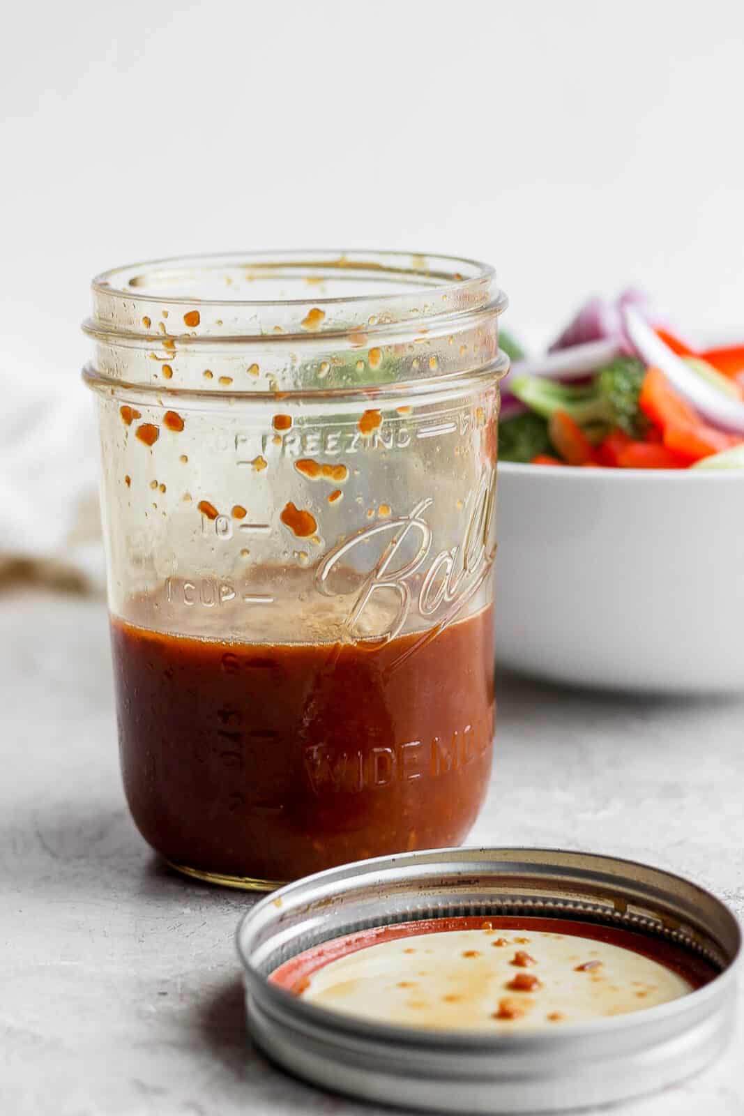 Stir fry sauce ingredients in an open mason jar.