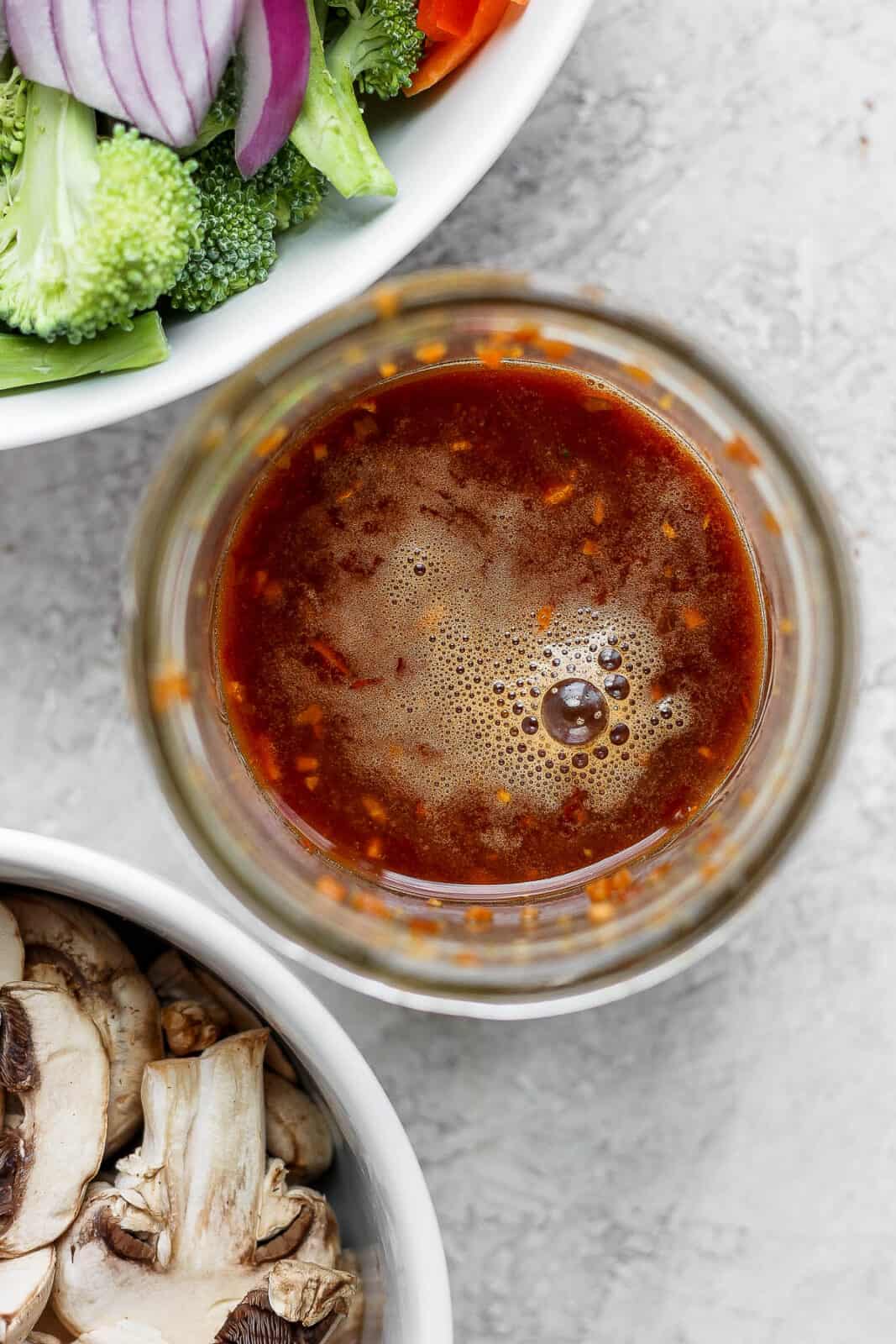 Top view of stir fry sauce in a mason jar.