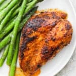 Plate of blackened chicken with asparagus.