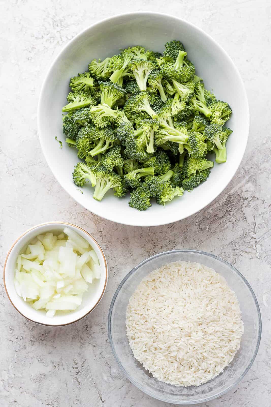 Bowls with broccoli, onion, and rice.