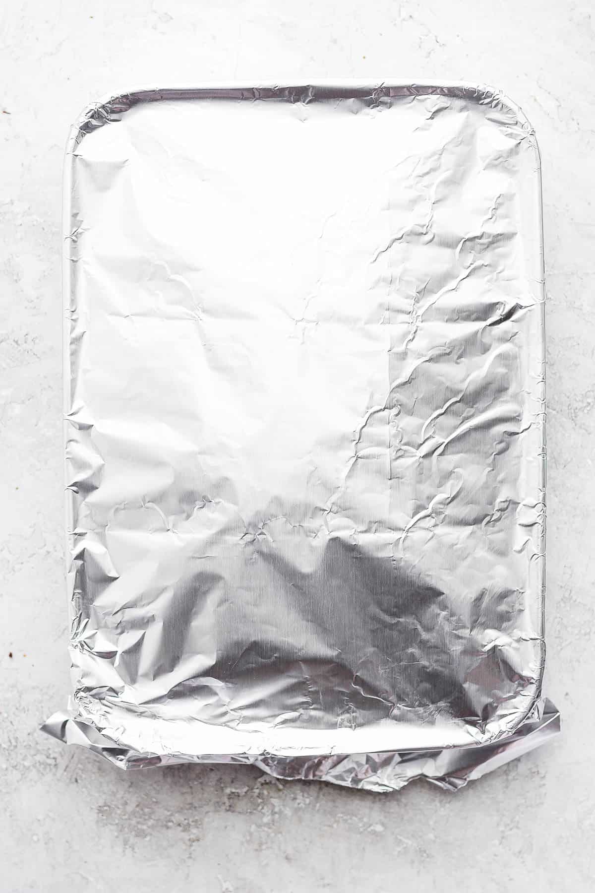 Lasagna covered with aluminum foil.