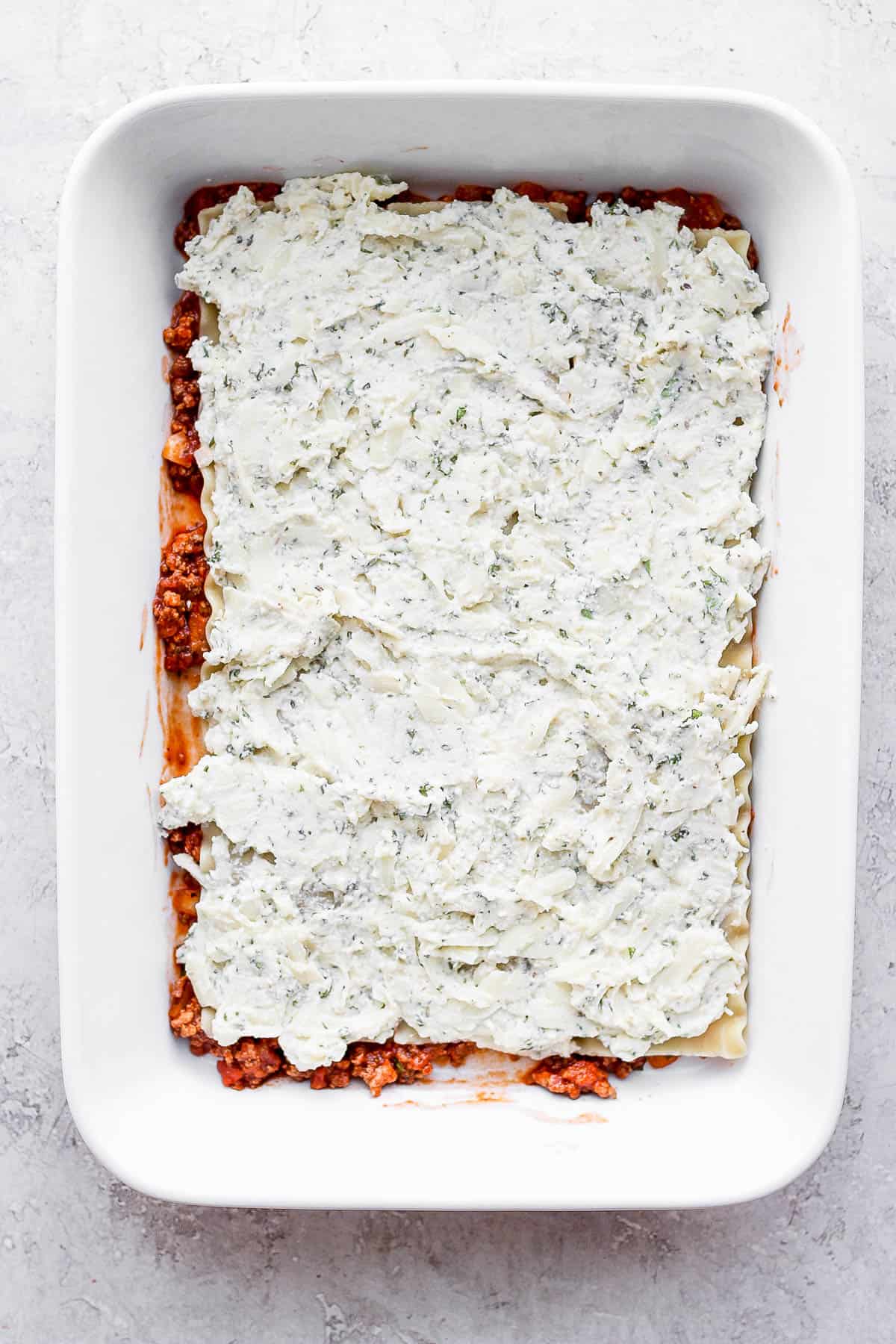 Ricotta mixture added on top of the noodles.