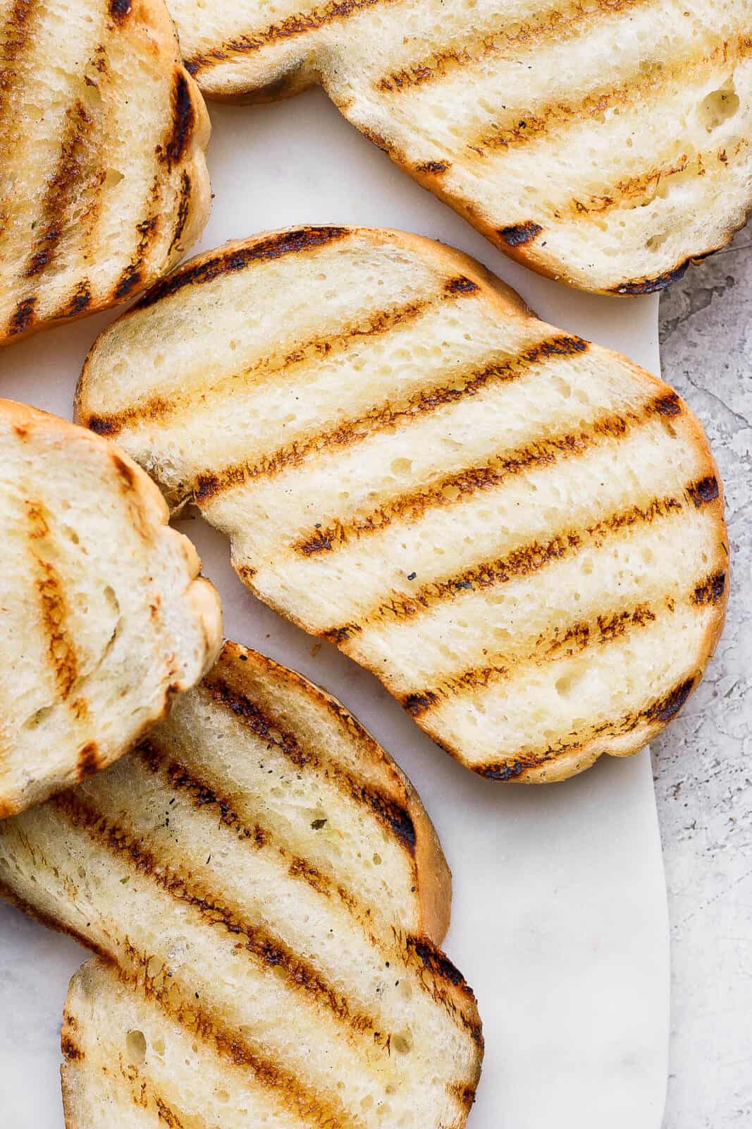 Slices of grilled bread on a plate.