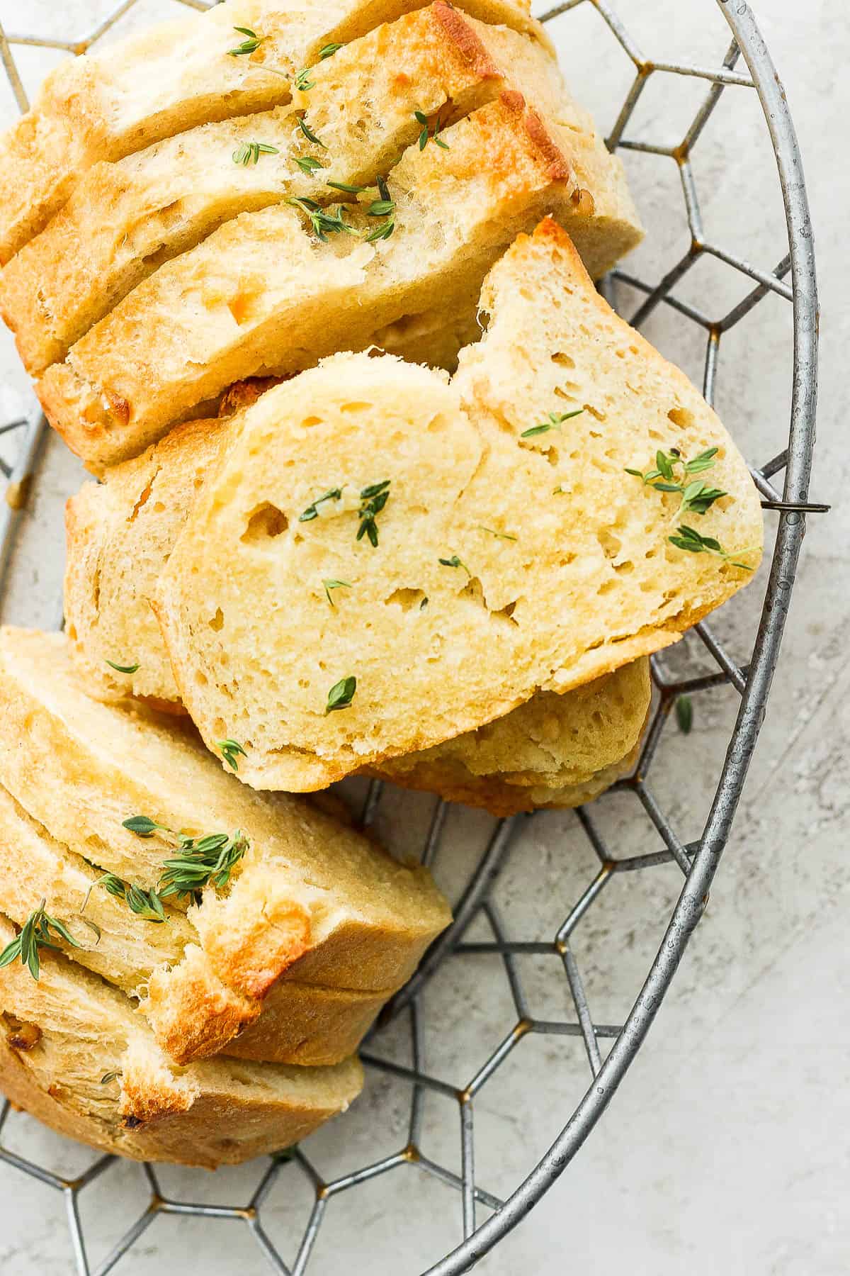 Sliced garlic bread in a basket.