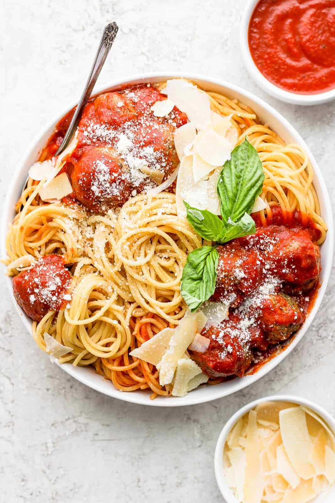 Bowl of spaghetti, marinara and pesto meatballs. 