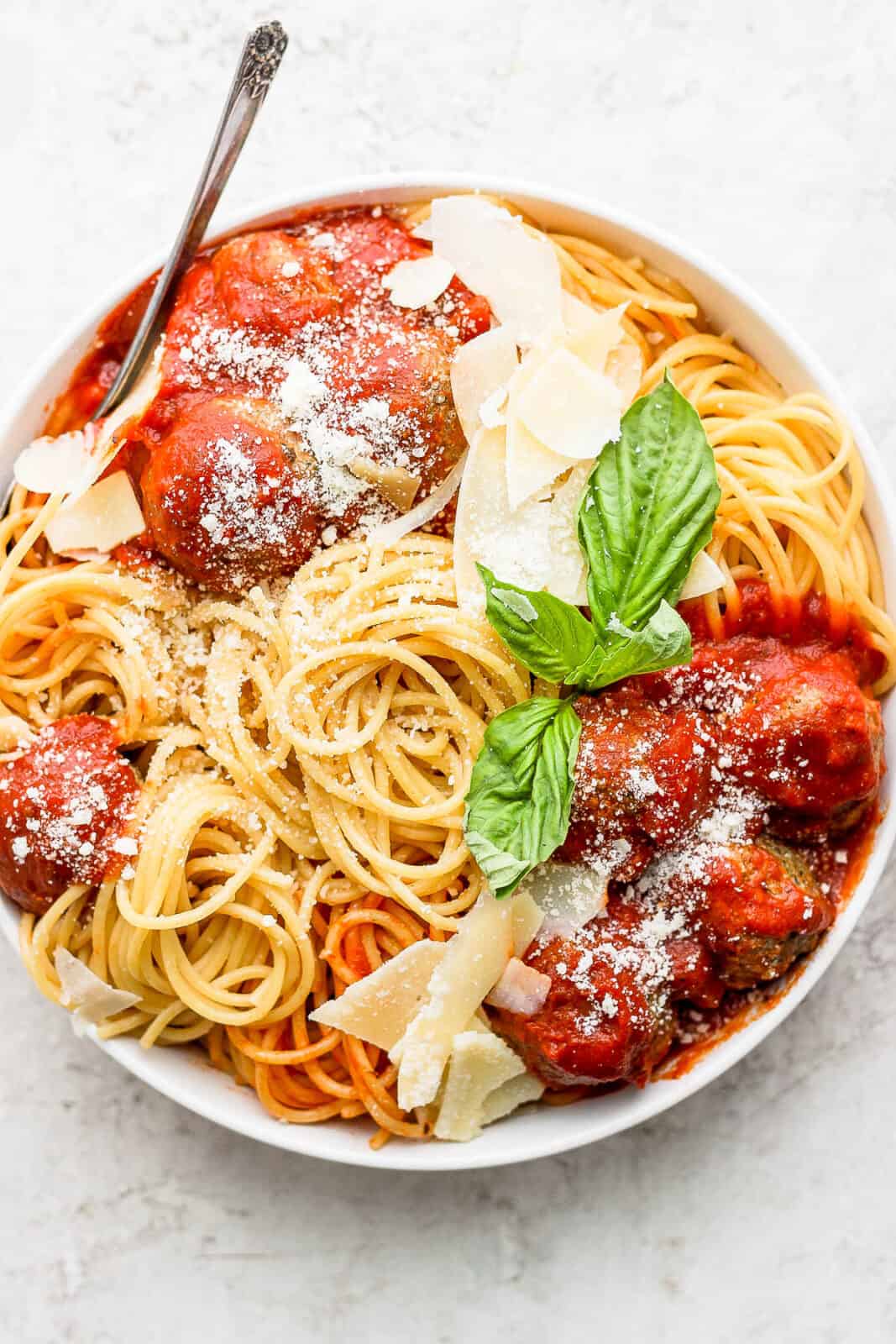 Bowl of spaghetti, marinara and pesto meatballs. 