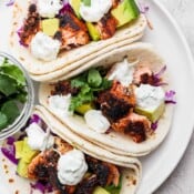 Plate of three blackened salmon tacos.