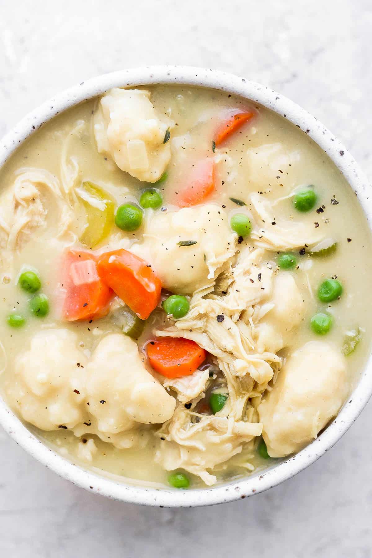 A bowl of chicken and dumpling soup.