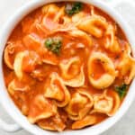 Bowl of chicken tortellini soup.