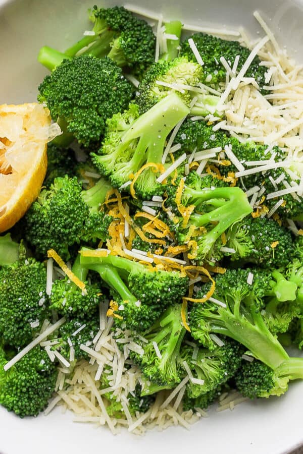 Bowl of parmesan broccoli with lemon.