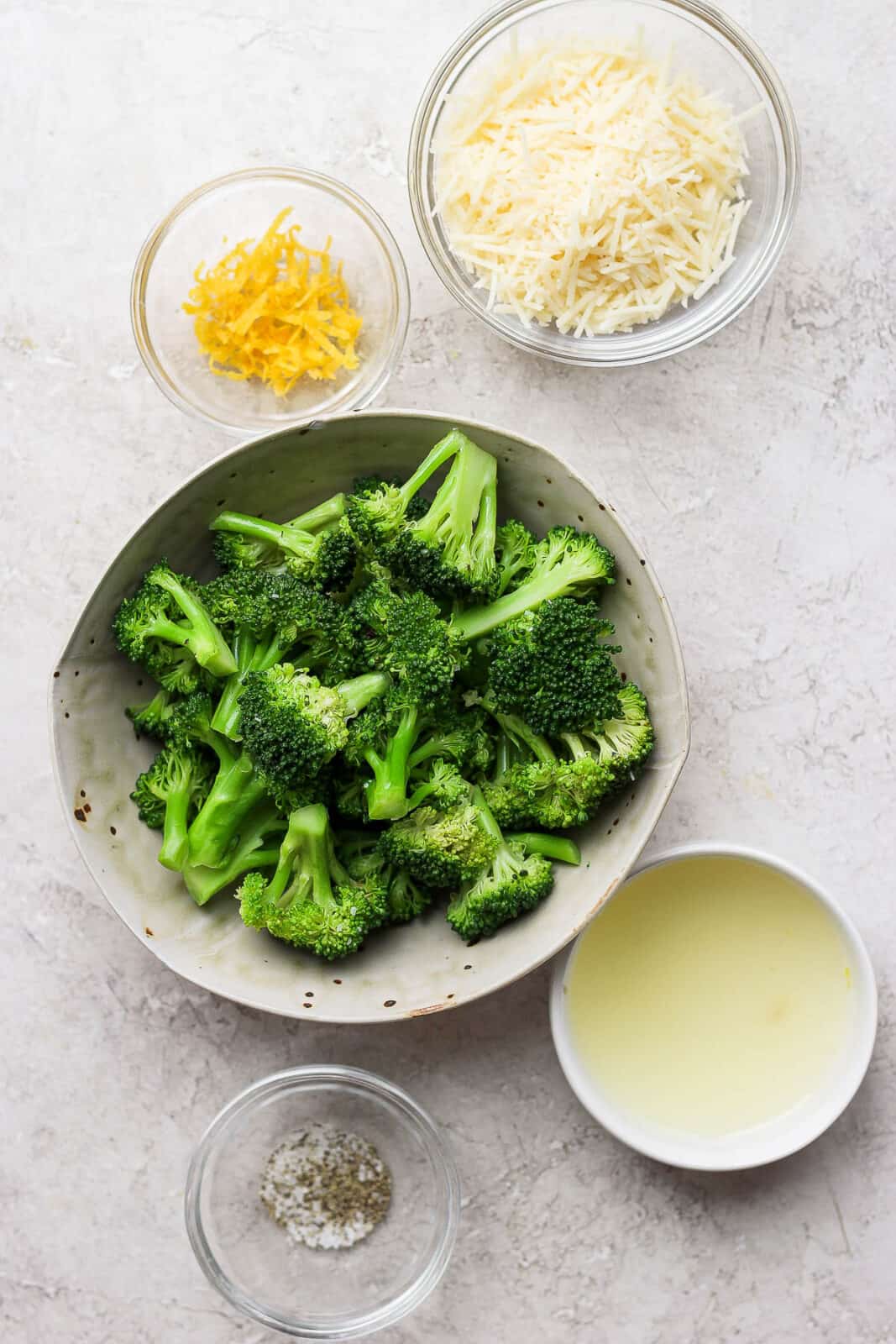 Ingredients for parmesan broccoli in bowls. 