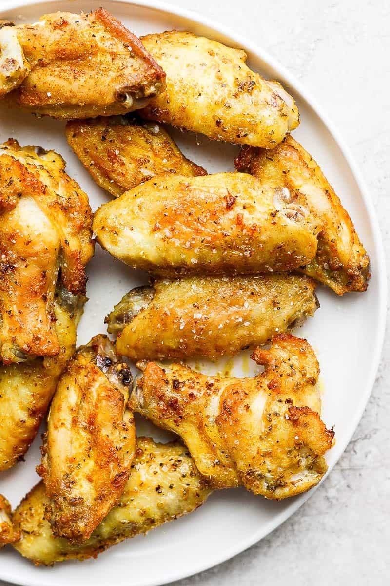 Crispy air fryer chicken wings on a plate.