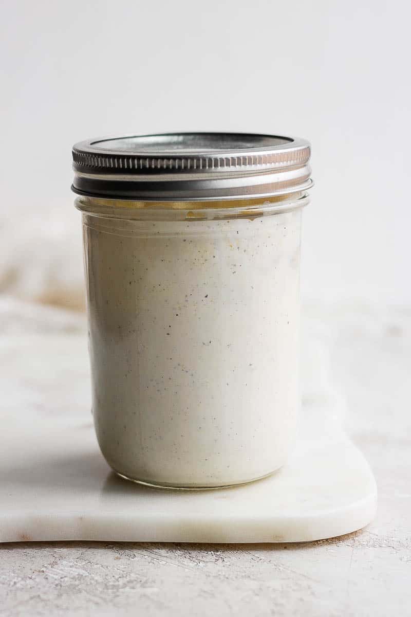 Blue cheese dressing in a mason jar with a lid.