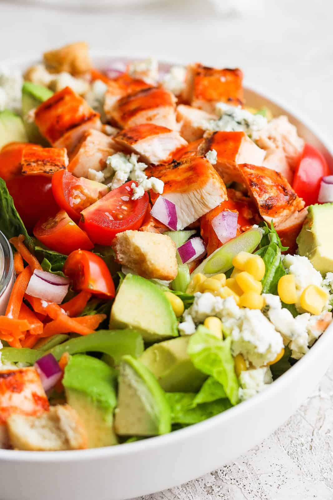 Close-up look at the grilled buffalo chicken on the salad.