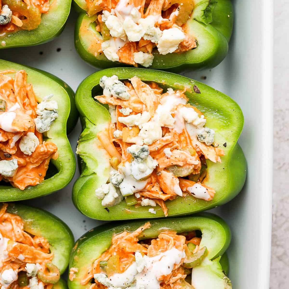 A pan filled with buffalo chicken stuffed peppers.