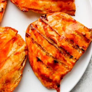 A plate of grilled buffalo chicken breasts.