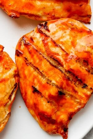 A plate of grilled buffalo chicken breasts.