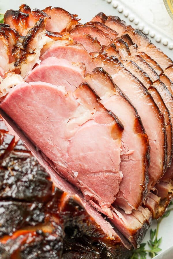 A honey glazed ham on a platter.