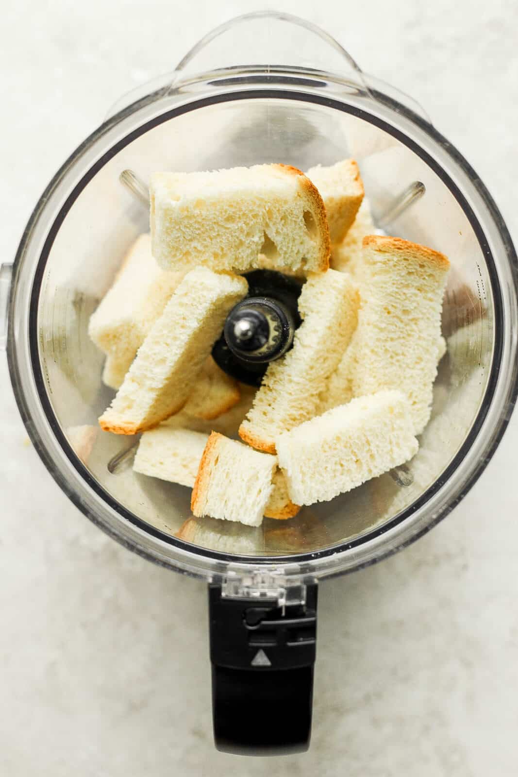 Cubed bread in a food processor. 
