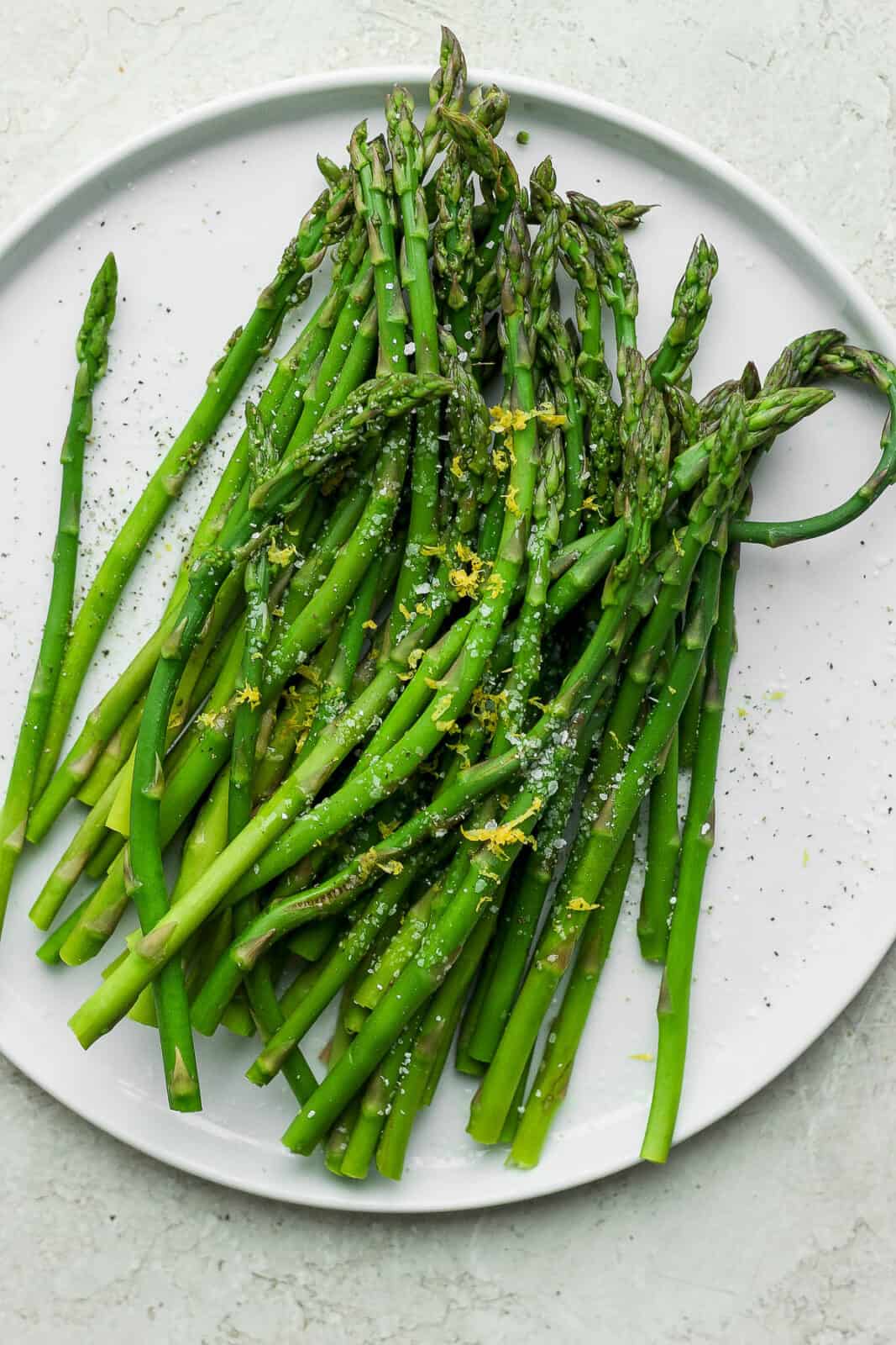 Quick and easy steamed asparagus on a plate.