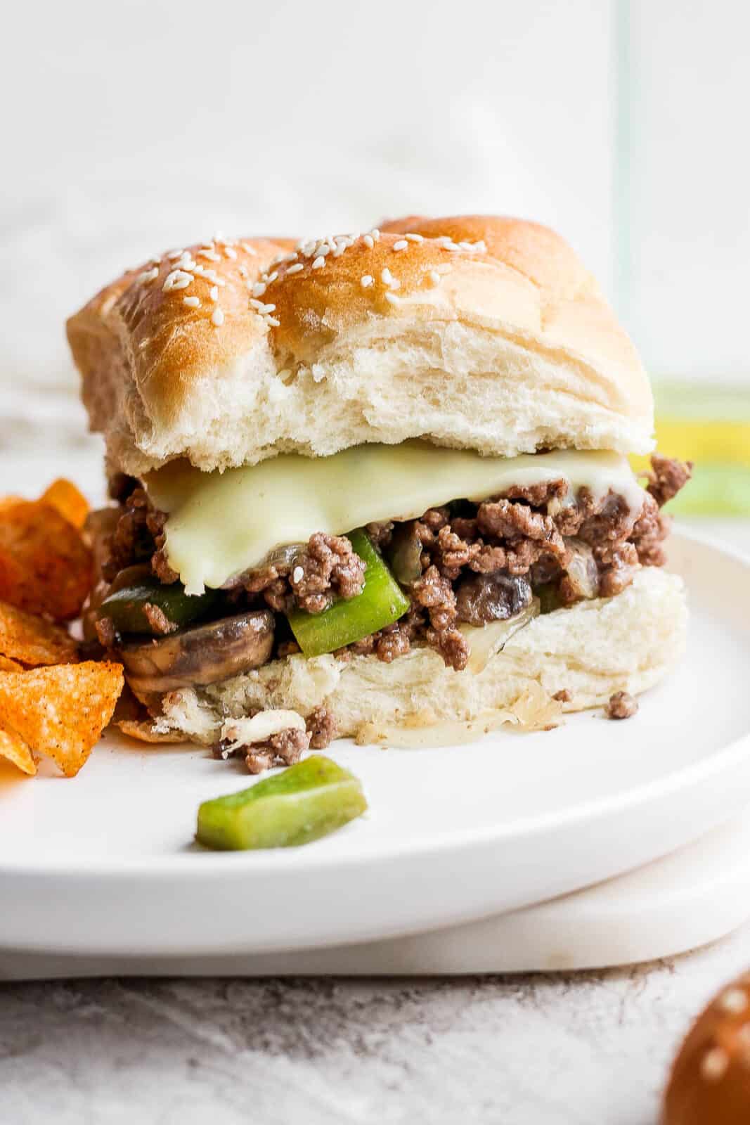 A philly cheese steak sloppy joe on a plate.