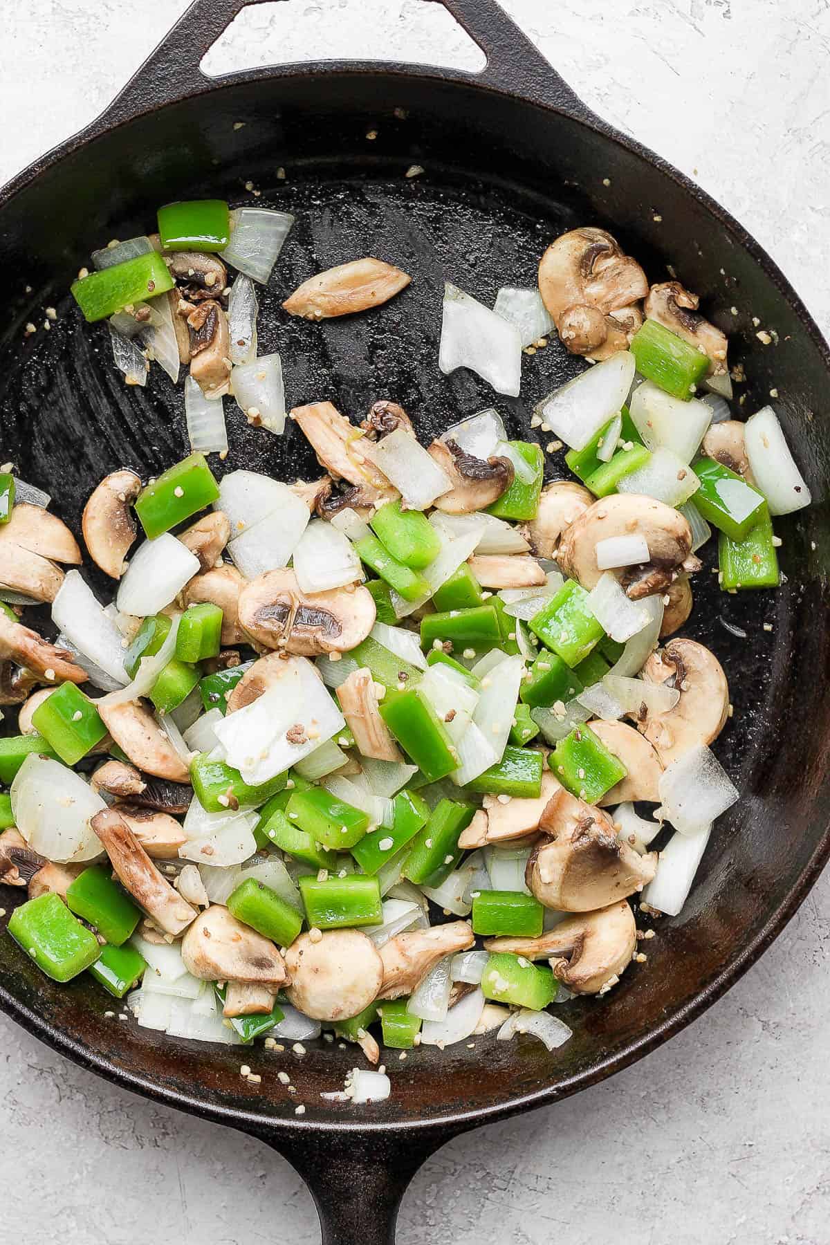 Mushrooms added to the skillet.