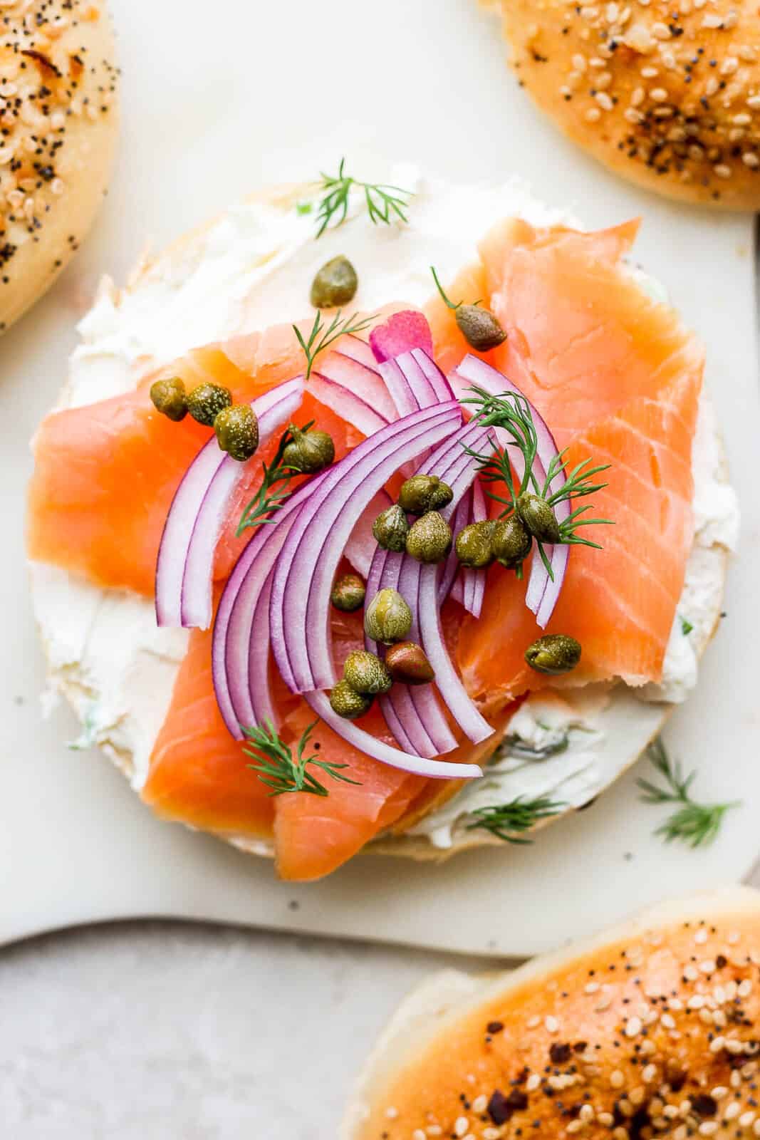 A lox bagel with all the toppings.