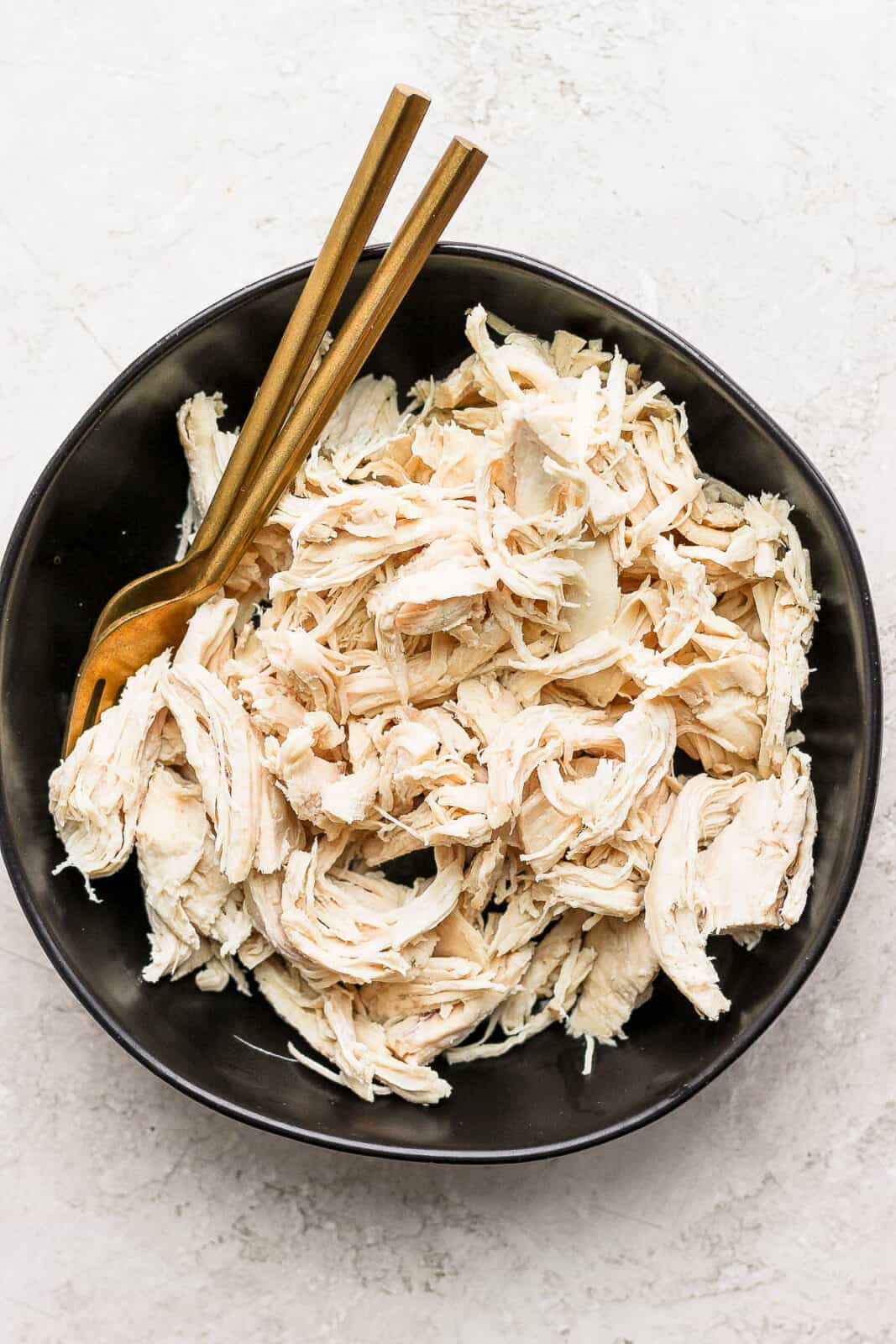 A bowl of pulled smoked chicken. 