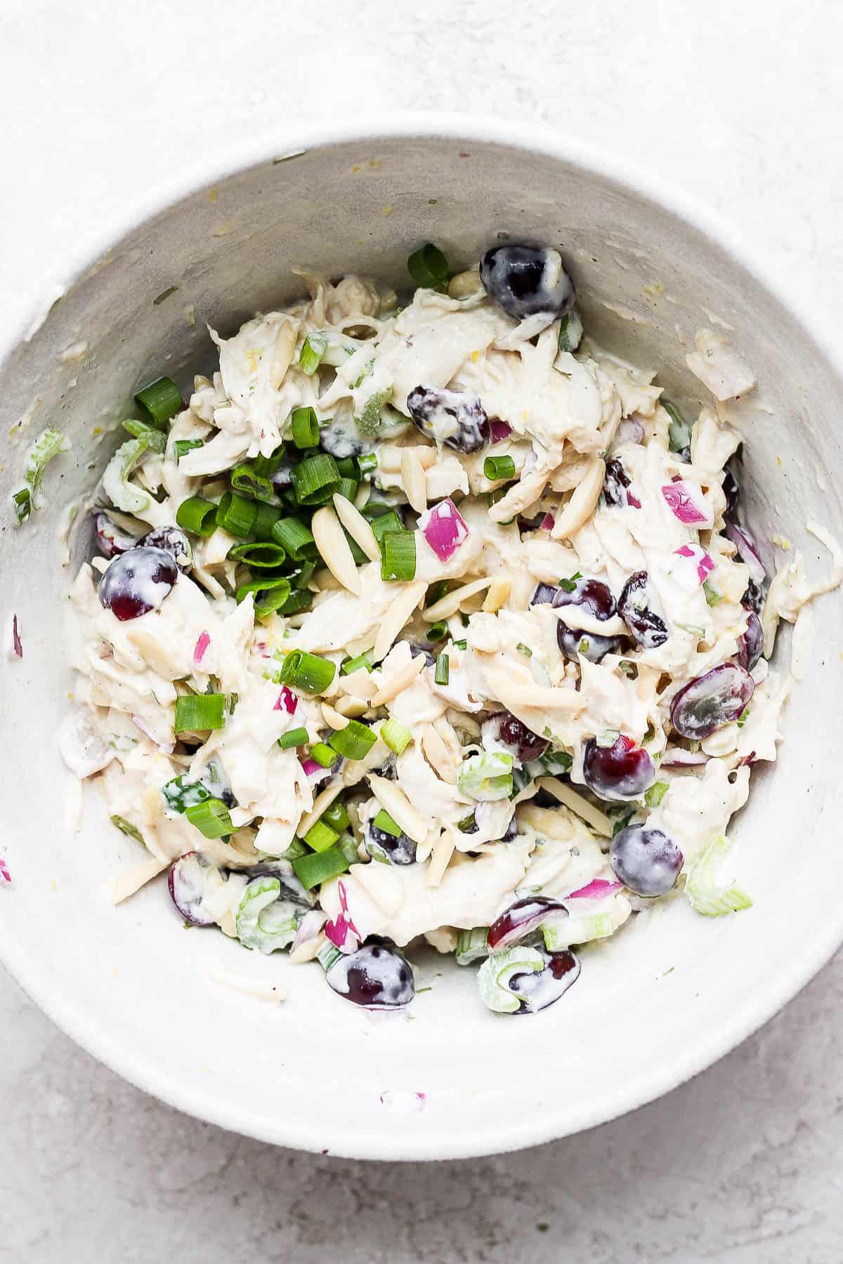 Smoked chicken salad all mixed up in a bowl. 