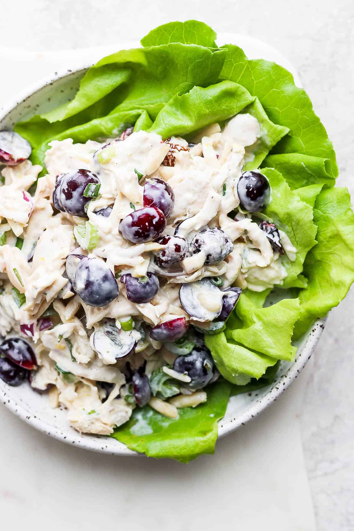 Smoked chicken salad on a bed of lettuce.