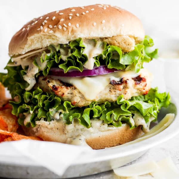 A chicken caesar burger on a plate.