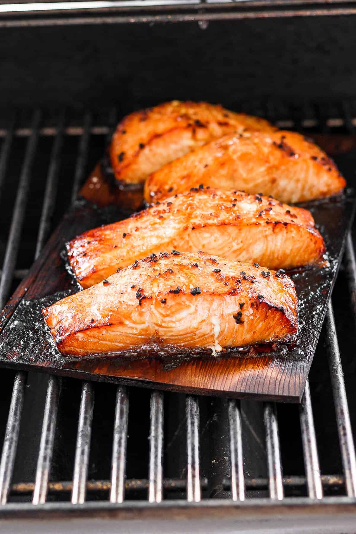Salmon cooking on the grill.