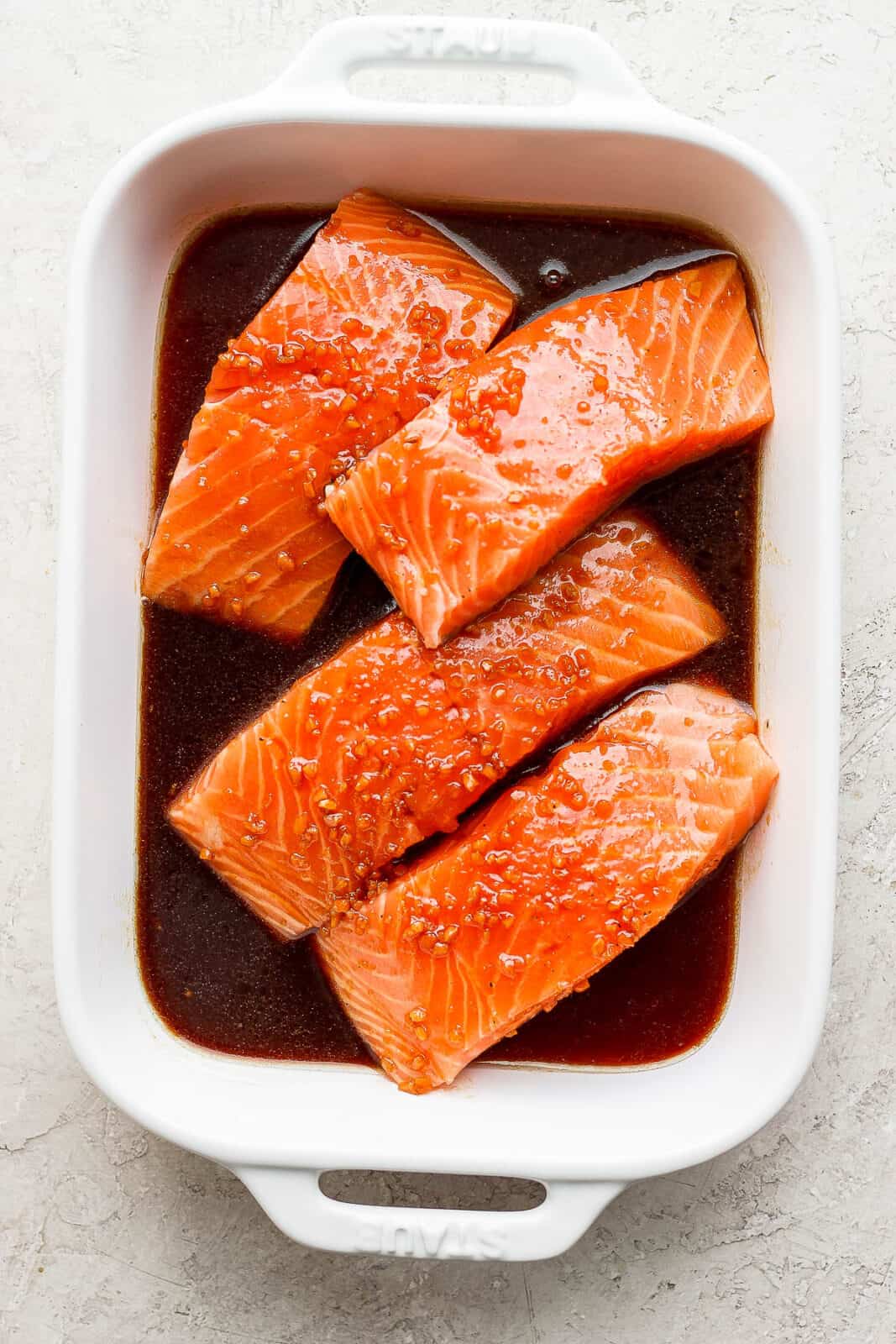 The best salmon marinade in a baking dish with salmon fillets.