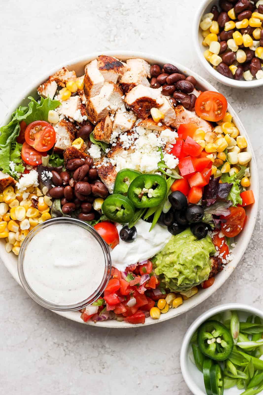An easy southwest salad in a bowl with all the toppings.