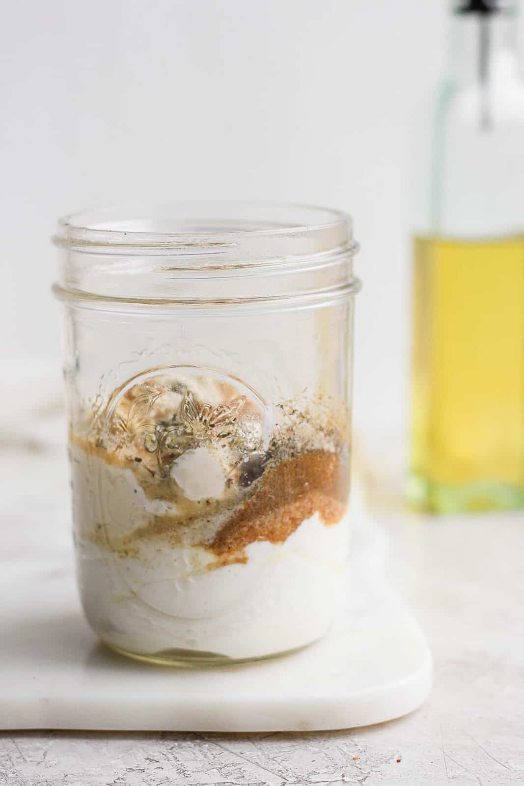 Ingredients for southwest salad dressing in a mason jar before mixing.