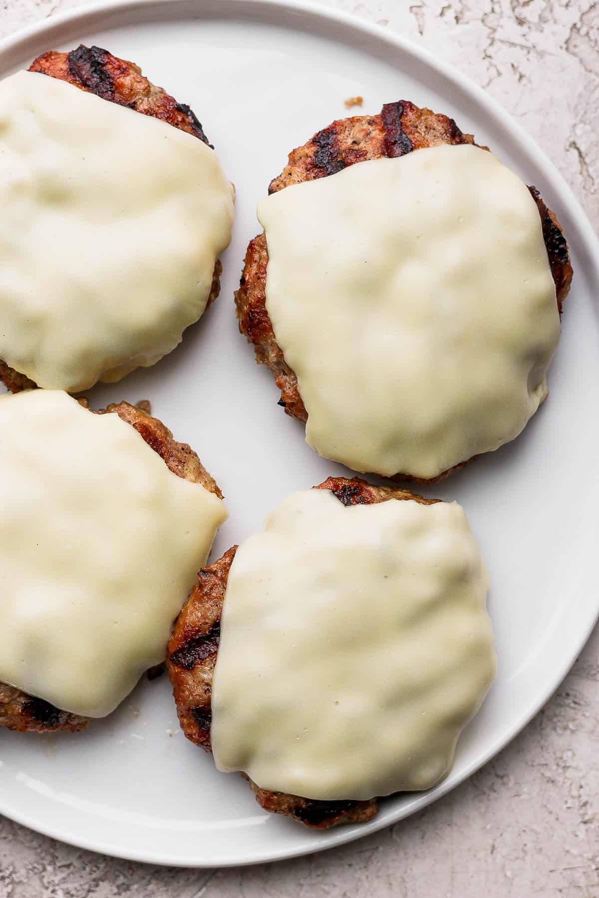 Juicy grilled turkey burgers with cheese.