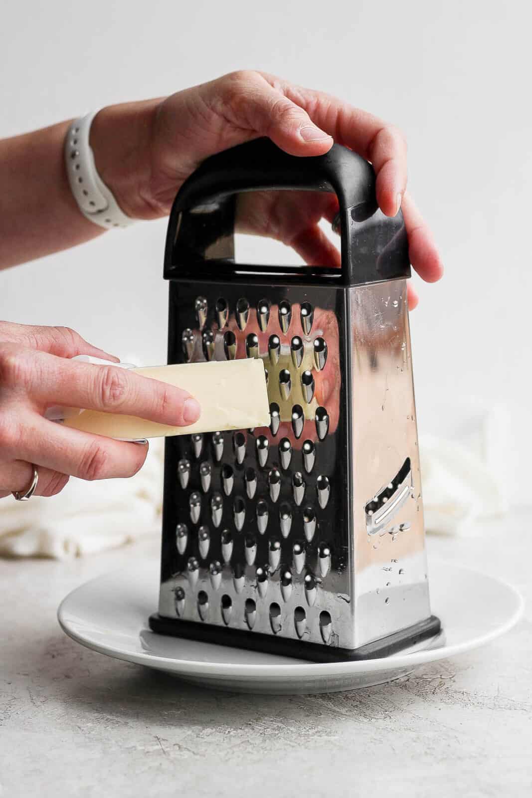 Grating a frozen stick of butter.